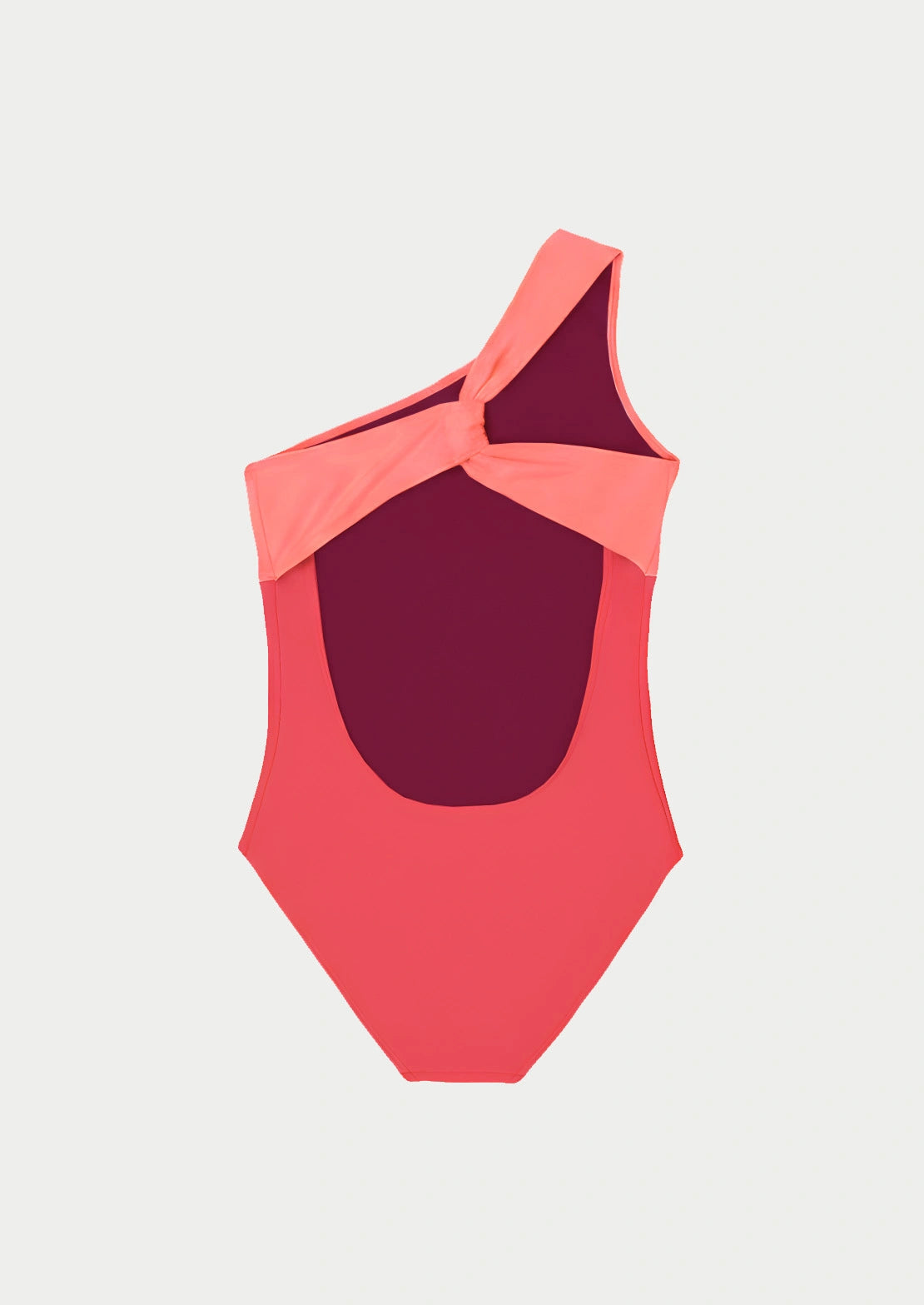 Silueta de la parte trasera del bañador Asimétrico Coral sobre fondo blanco para niñas y adolescentes