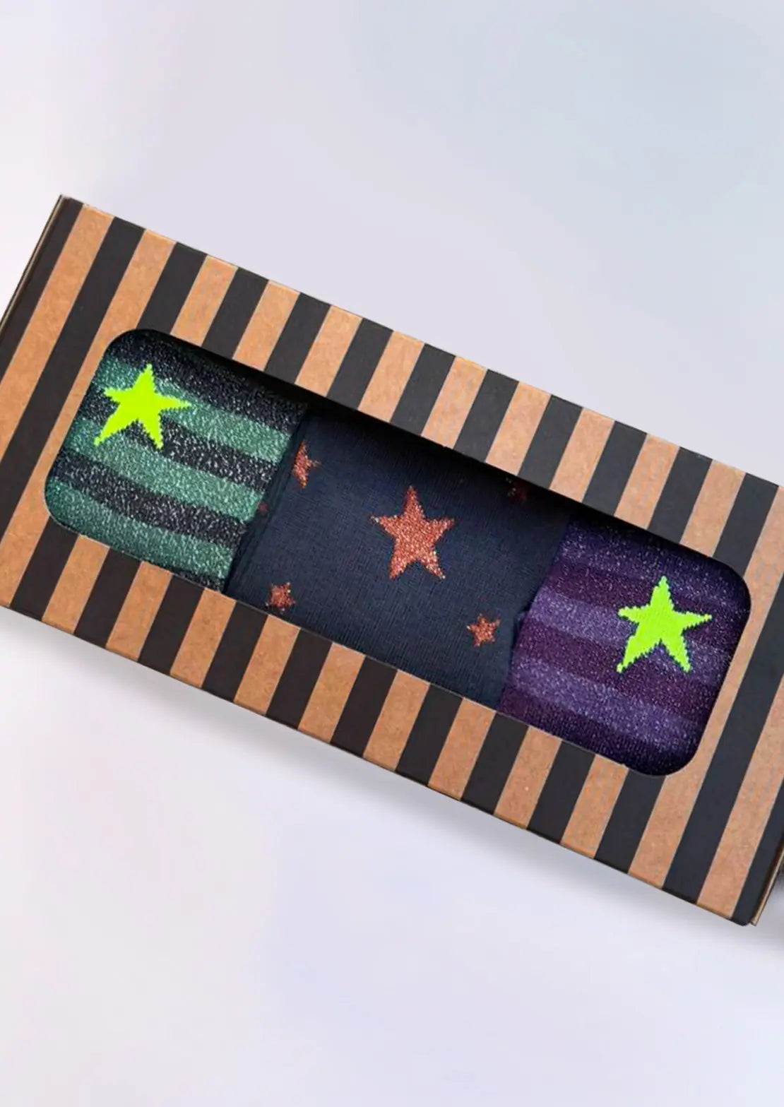 Caja de 3 pares de calcetines lurex stripes de To the Moon con lúrex de caña baja con toques en neón.
