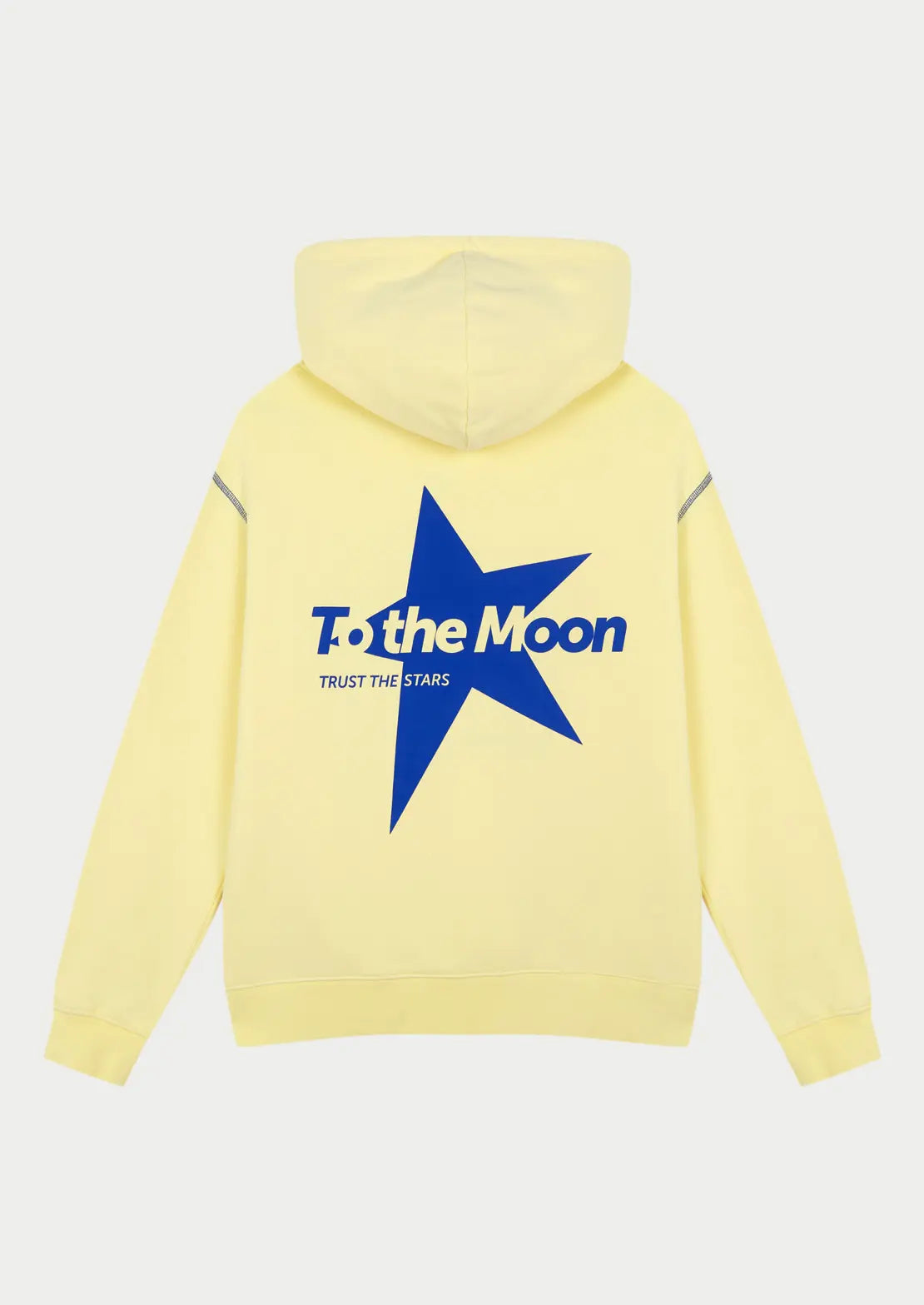 Hoodie Butter  Yellow ideal para teens en color amarillo claro con capucha y bolsillo canguro de To the Moon. Serigrafía con estrella en azul eléctrico en la espalda.
